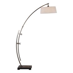 a floor lamp with a white shade on it's head and a black base