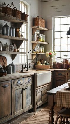 an old fashioned kitchen with wooden cabinets and open shelves