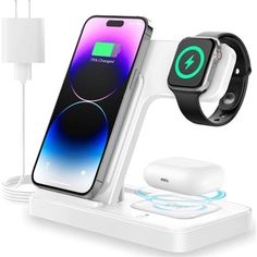 an apple watch and charging station with wireless devices