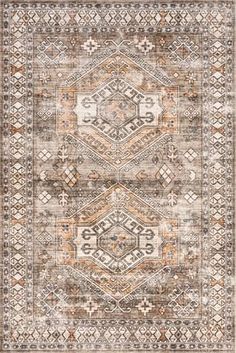 an area rug with various colors and patterns on it, including beiges, oranges,