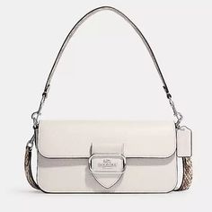 As Always Coach Comes Out With Another Morgan Bag In A Solid Chalk. Soft Pebble Leather. Very Beautiful In Person With Snake Design Straps. I Love This Bag Because It’s The Perfect Size For All Your Daily Essentials And Can Be Worn At Different Lengths. Use It As A Dressed Up Look Or Casual. Authentic From Coach. Perfect Gift For Someone Special. All Sales Are Final, So Feel Confident When Buying From My Collection Designer White Coach Shoulder Bag, White Top Handle Bag With Silver-tone Hardware, White Shoulder Bag With Silver-tone Hardware, Designer White Coach Bag, White Coach Evening Bag, White Rectangular Coach Shoulder Bag, White Crossbody Bag With Silver-tone Hardware, White Coach Shoulder Bag For Formal Occasions, Designer White Bags With Silver-tone Hardware