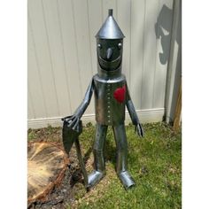 Yard Decorations: Our Tin Man Garden Statue Truly Has A Big Heart. Your Friends And Family Will Love To Be Greeted By This Captivating Metal Statue. Weather Resistant Decor: This Tin Woodsman Is Made Of Durable Soldered Iron And Has A Weather-Resistant Finish To Avoid The Elements. It Is Sure To Create A Dramatic Focal Point In Your Yard Or Home. Outdoor Sculptures: Our Outdoor Tin Man Sculpture Will Make A Dramatic Statement To Your Yard, Patio, Or Garden. He Comes Complete With A Funnel Hat An Heart Garden, Man Sculpture, Metal Statue, Wood Yard Art, Yard Decorations, Tin Man, Garden Statue, Soft Cooler, Outdoor Sculpture