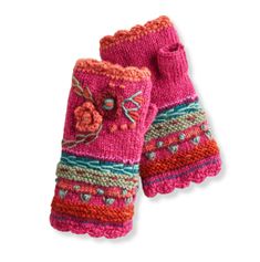 two pink knitted mittens with flowers and hearts on the front, one has a flower in the middle