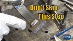 a man working on some metal parts with the words don't skip this step