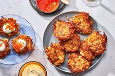 some food is sitting on a plate with sauces and condiments next to it