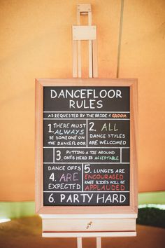 a chalkboard sign that says dancefloor rules