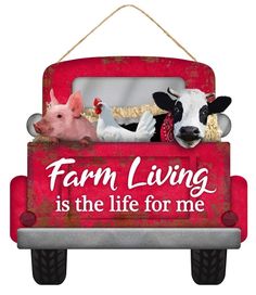 a red sign that says farm living is the life for me with two cows in it