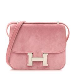 This is an authentic HERMES Veau Doblis Constance 18 in Rose Indienne. This classic bag is finely crafted of Veau Doblis suede leather in pink with a matching shoulder strap. The top flap opens with a palladium H clasp to a partitioned pink leather interior with patch pockets. Luxury Shoulder Bag With Suede Lining, Hermes Constance Bag, Hermes Purse, Dream Bag, Hermes Constance, Classic Bags, Pretty Bags, Hermes Bags, Pink Leather