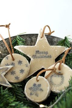 no - bake salt dough ornaments on a plate with pine branches and snowflakes