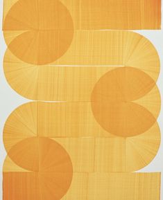 an orange and white painting with circles on it