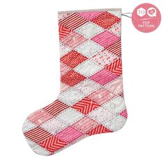 a red and white christmas stocking hanging from the side with a pink ribbon around it