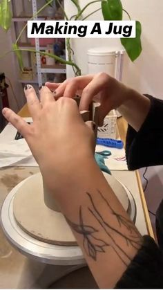 a person is making a tattoo on their arm with the words making a jug above them