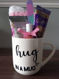 a mug filled with various items on top of a wooden table