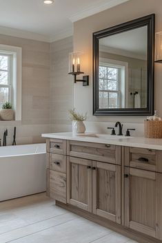 a bath room with a tub a sink and a mirror on the wall in it