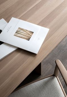 an open book sitting on top of a wooden table