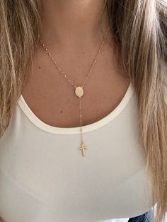 This 14K yellow gold rosary necklace is the perfect religious symbol of faith. Featuring a cross pendant, shiny diamond cut 2.5mm round beads, and a 20” chain, this necklace is a meaningful piece of Catholic jewelry. Its delicate design makes it an ideal gift for anniversaries, confirmations, 1st communion and other special occasions. ♦ Materials: 14K Solid Gold♦ Available colors: Gold ♦ Necklace measurements: 20" total length, beads are 2.5MM♦ Beads measurements: Beads are 2.5MM---------------- Luxury Gold Rosary As Gift, Yellow Gold Cross Pendant Jewelry With Miraculous Medal, Yellow Gold Cross Necklace With Miraculous Medal, Yellow Gold Jewelry With Miraculous Medal Cross Pendant, Yellow Gold Cross Rosary As Gift, Gold Rosary Necklace, Rosary Chain Necklace, Necklace Measurements, Gold Rosary