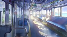 the interior of a subway car with blue seats