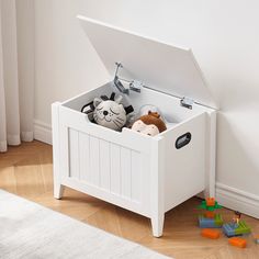 a toy chest with stuffed animals in it