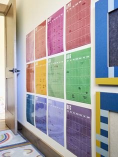 a colorful wall with calendars on it