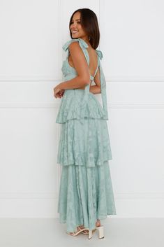 Length from bust to hem of size S: 114cm. Chest: 37cm, Waist: 32cm, across front only of size S. Maxi dress. Lined. Model is a standard XS and is wearing size XS. True to size. Non-stretch. Textured fabrication. Tiered frill hem. Open back. Elastic back with silver closure. Tie-up shoulder straps. Zipper. Print placement may vary. Cold hand wash only. Polyester/Spandex. Enter the room in an extravagant style. The Alix Maxi Dress features a tiered frill skirt, an open back, and tie-up shoulder st Frill Skirt, Dress Sage, Prom Shopping, Print Placement, Formal Wedding, Printed Maxi Dress, Sequin Dress, No Frills, Homecoming Dresses