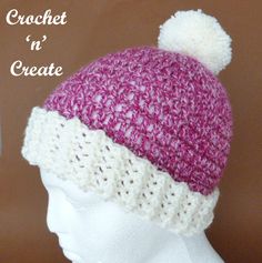 a crochet hat with a pom - pom on top is shown