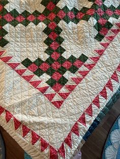 a quilt is laying on top of a table