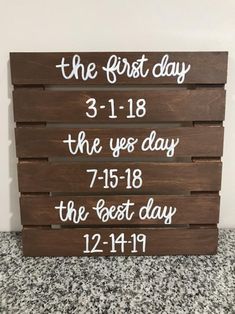 a wooden sign that says the first day