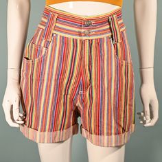 Super cute high waist shorts with a wide waistband, wide legs, and pockets. Multi-colored striped pattern - The colors are bright and clear.  Wide waist band - 2 3/4" with 2 metal buttons. Rolled cuffs on the leg. Belt loops. LABEL: Nada Nuff, Contempo Casuals. Made in Hong Kong.  SIZE: Marked 9  Refer to measurements for an accurate fit. All sizes are approximate. Waist: 27" Hip: 40 1/2" Length: 16" Inseam: 3" Rise: 11 1/2" Mannequin measurements:   Size 2, Bust 33"   Waist 24"   Hips 34" CONDITION: Excellent, pre-owned shorts.  COLOR: Multicolor- yellow, red, green, orange, purple + more. MATERIAL: Cotton, metal zipper. CARE: Machine wash OK.  Domestic Shipping: Priority Mail including tracking and insurance.   NO RETURNS: Vintage items are often fragile or one of a kind, our items are F 80s Outfit, Wide Waist, High Waist Shorts, Wide Legs, Vintage Shop, Wide Waistband, Metal Buttons, Striped Shorts, Waist Band