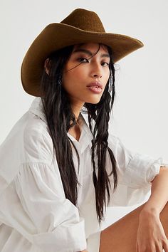 So chic western-inspired hat featured in a classic cowboy shaped silhouette with a cattleman crease crown, upturned brim, and interior ribbon adjuster for a so-perfect-fit. * Interior sweatband * Adjustable fit * Structured style | Cash Cowboy Hat by Wyeth at Free People in Brown Brown Cowboy Hat, Hat Aesthetic, Hat Wool, Western Hats, Outfits With Hats, Cool Hats, Wool Hat, Cowboy Hat, Hat Shop