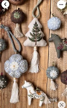 some ornaments are hanging on a wooden table