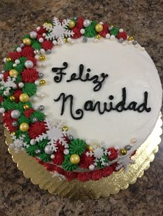 a decorated cake with the words feliz navidad on it