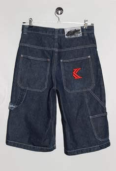 "Karl Kani jean shorts, with brand logo embroidery in red on the back pocket. - Size tag: Please always check measurements before buying. Tag reads size 30, Men's S - Measurements (laying flat): Waist: 15.5\" Outleg: 26\" Inleg: 14\" Thigh: 13.5\" Rise: 13\" Leg opening: 11.5\" -Wear: /Please see images for details/ Good vintage condition. The leather tag on the back is peeling. - Fabric: 100% Cotton *All of our items are preloved pieces so some signs of natural wear and age are to be expected. Please look through the photos carefully to check if the condition is to your satisfaction.  *All efforts are made to show any defects however small imperfections may be missed. In cases that we've missed a major flaw, please remember that we are still human and make mistakes, please contact us firs Dark Wash Jean Shorts For Streetwear, Dark Wash Five-pocket Shorts For Streetwear, Dark Wash Five Pocket Shorts For Streetwear, Streetwear Shorts With Five Pockets, Five-pocket Streetwear Shorts, Dark Wash Shorts With Pockets For Streetwear, Streetwear Jean Shorts With Hip Pockets, Hip Pocket Jean Shorts For Streetwear, Dark Wash Cotton Jean Shorts With Hip Pockets