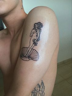 a woman with a tattoo on her arm