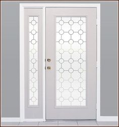 a white door with frosted glass on the top and side panels, in front of a gray wall