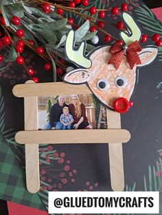 a wooden frame with a reindeer head on it