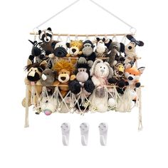 a bunch of stuffed animals are hanging from a rack with two pairs of white shoes