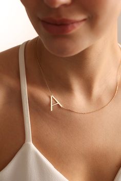 "Big letter necklaces are perfect for all outfits. It is so dainty, elegant and chic. Here you will find the super elegant initial necklace with us. You may design your alphabet necklace with any large letter you want. This sideways necklace will be a great silver gift idea for any women or mom. Big Letter form becoming really original and stylish. So you will have one of the most stylish gift in the world.  The gold name necklace is a durable solid necklace. First quality materials are used while producing our letter necklaces.  Our chains are produced by hand with a special system. It has a solid form. All our jewelry is %100 custom made by hand with Love and Care in our workshop! Nickel Free High Quality Materials Standard Deliver in 8-20 Business Days Name size - lowercase letters are Initial Necklace Big, Elegant Everyday Letter Necklace, Simple Initial Pendant Necklace With Clavicle Chain, Simple Initial Necklace With Clavicle Chain, Minimalist Monogram Letter Necklace, Minimalist Monogram Necklace, Minimalist Initial Necklace With Custom Name, Name Chain Gold, Name Chain