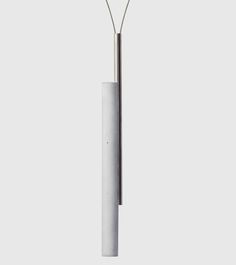 a white lamp with a long metal pole