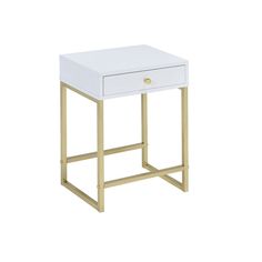 a white and gold side table with one drawer on the bottom, two drawers on the top