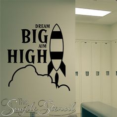 a wall decal that says, dream big aim high the simple pencils are on it