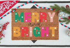 a merry and bright christmas door mat with ornaments around it on top of a table