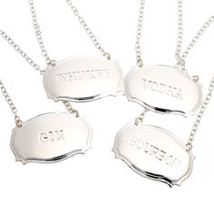 three silver necklaces with the words virginia on them