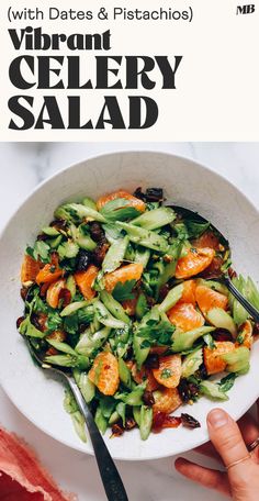 a white bowl filled with salad on top of a table