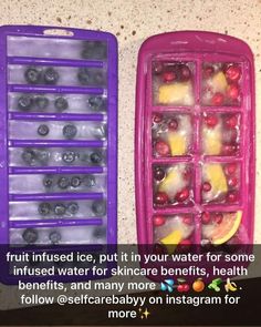 two plastic trays filled with fruit and ice cubes on top of a counter