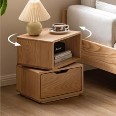 a wooden table with two drawers and a lamp on it next to a couch in a living room