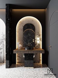 a black and white bathroom with a marble counter top in the middle, an arched doorway leading to another room