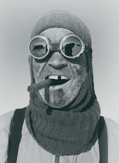 a man wearing goggles and a scarf