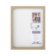 a wooden frame with an ad for the sewing room