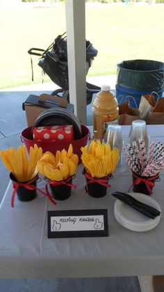 the table is set up with sunflowers and other items