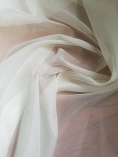 "Organza Chiffon sheer creme color 110 inches wide Usable for drapery and interior Designing .. End user wall hanging, drapery, sheer decorations, etc. Fabric is sold by the yard - to order, select the desired quantity of yards from the drop-down list, each yard will show in your shopping cart as an item but they will ship as one continuous piece Width : 110\" inches Color : Creme Thank you for your coming! Please read policy before placing an order. Please contact us via ETSY Conversations for Silk Chiffon Fabric, Silk Wallpaper, Cream Aesthetic, Creme Color, White Chiffon, Organza Fabric, Fabric Suppliers, Silver Mirror, Interior Designing